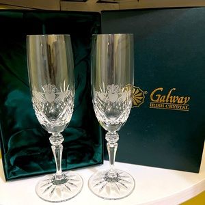 A beautiful pair of Galway Irish Crystal Champagne Flutes with Claddagh design